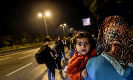 Refugees in Turkey walk on a highway towards Edirne, close to the Greek border, on 21 September. 