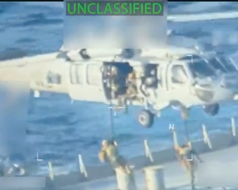 US forces land on the tanker from a helicopter