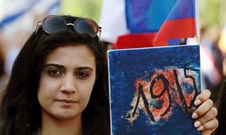 A woman holds a placard bearing the date ‘1915’ during a march on Tuesday in Yerevan.