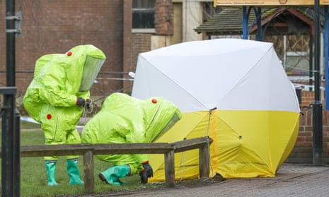 Personnel in hazmat suits working to secure a tent covering a bench in the Maltings shopping centre in Salisbury, where former Russian double agent Sergei Skripal and his daughter Yulia, were found critically ill by exposure to Novichok nerve agent.
