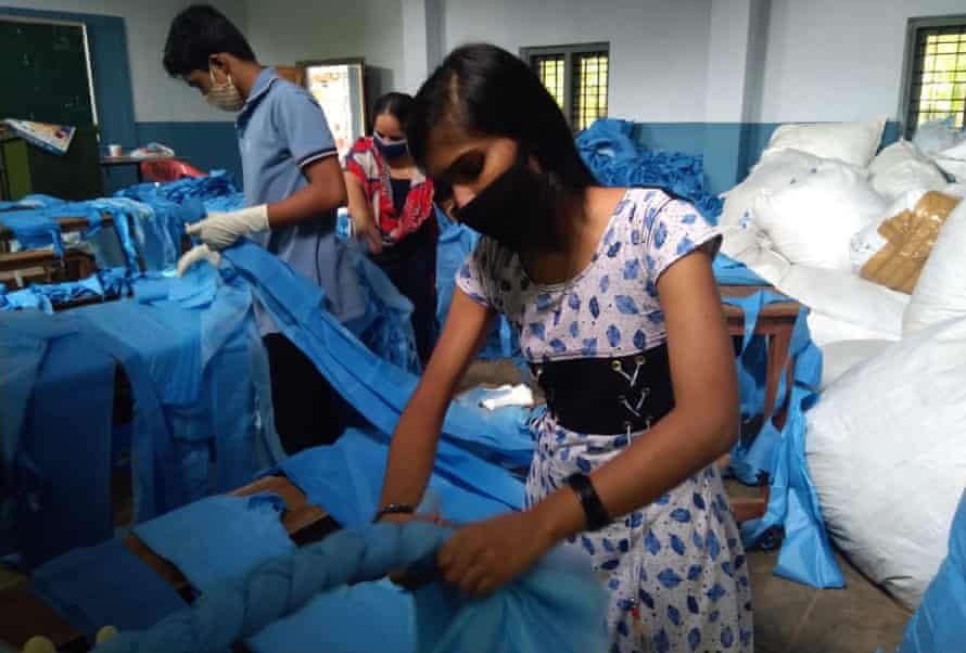 Stduents at a Kerala school making mattresses for the local Covid care centre.