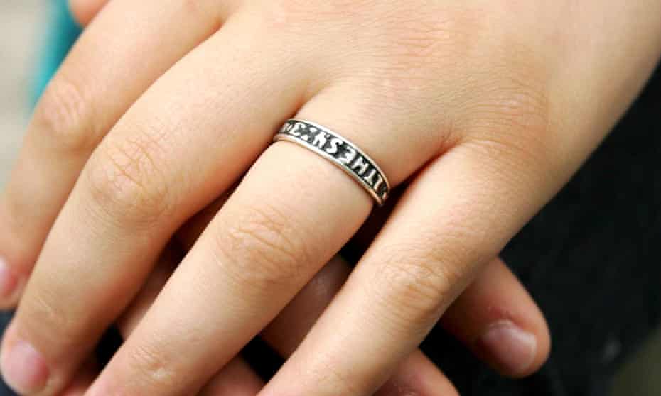 A woman wearing an abstinence ring