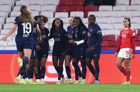 Paris St Germain's Jennifer Echegini (centre) celebrates scoring their first goal with teammates as Benfica's Catarina Amado looks dejected.