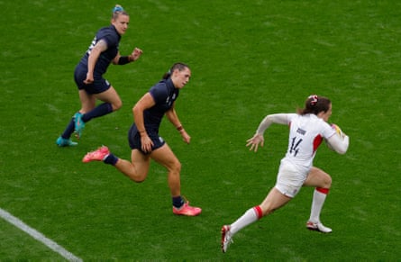 Abby Dow of England runs with the ball.
