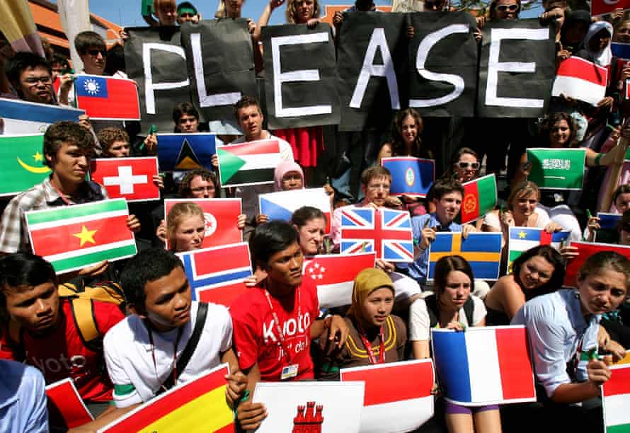 Protesters with national flags and a sign saying ‘Please’