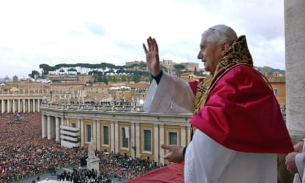 Pope Benedict XVI waves from a balcony of St Peter’s Basilica after being elected by the conclave of cardinals, 19 April 2005.