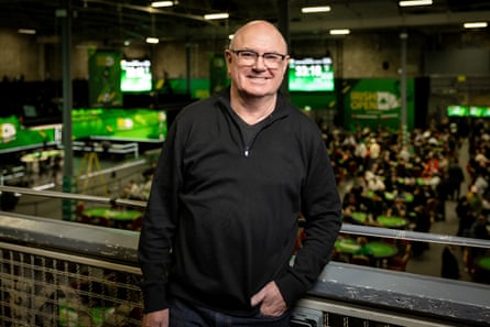 Gary Fisher standing on the balcony of an indoor arena