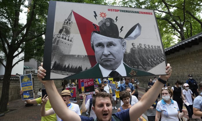 People march during a rally against Russia’s invasion of Ukraine, near the Russian embassy in Seoul, South Korea. (AP Photo/Ahn Young-joon).