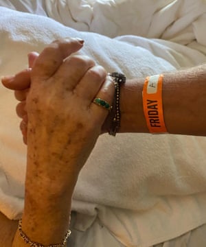 Jillian holds her mum's hand in the care home