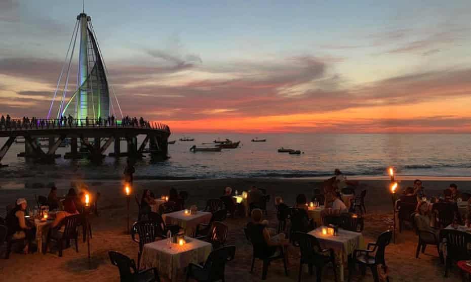 Cuates y Cuetes Mexico beach bar with sunset, sea and tower