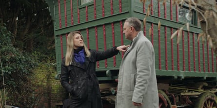 A woman points at a man's chest