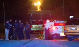 Police work the scene of the shooting late Friday in Tulsa.