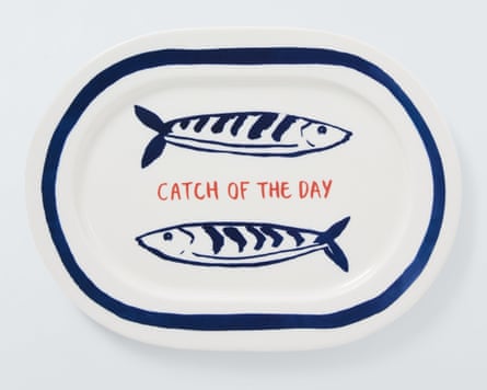 White oval platter with two illustrations of sardines above and below the words ‘catch of the day’