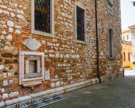 The side of an old church with a foundling wheel