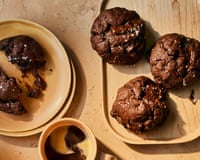 Edd Kimber's double chocolate olive oil cookies on plates, beside cups of coffee