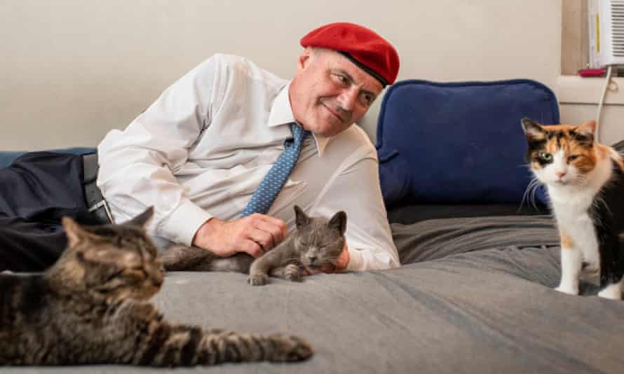 Curtis Sliwa, founder of the Guardian Angels and Republican candidate for mayor of New York, at home with three of 15 cats