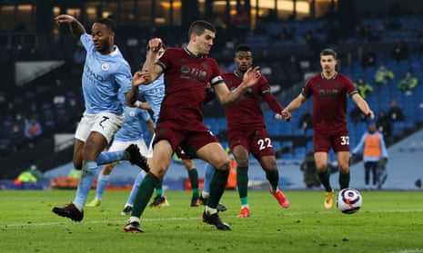 Raheem Sterling of Manchester City back heels the ball towards goal but goes just wide.