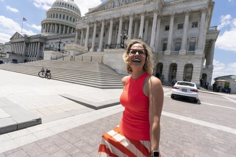Kyrsten Sinema smiles as she returns to the Capitol after a meeting with  Joe Biden at the White House in Washington in June.