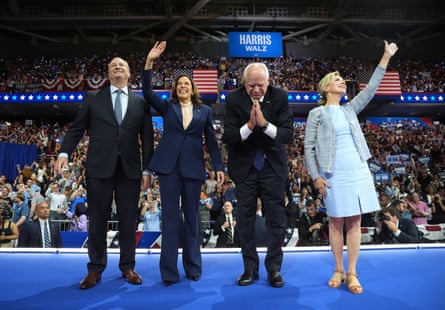 Kamala Harris and husband and Tim Walz and wife wave to the crowd on stage