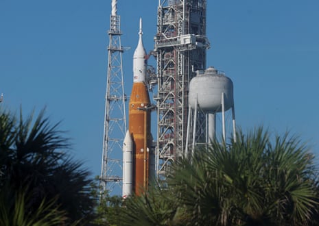 NASA’s next-generation moon rocket, the Space Launch System (SLS) rocket with its Orion crew capsule perched on top, stands on launch pad 39B at Cape Canaveral,