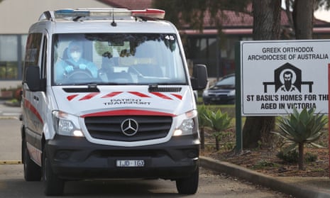 Medical staff prepare to transport people from the St Basil’s Home for the Aged in Fawkner, Melbourne.