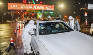 Medical staff at a checkpoint in China’s Shandong province