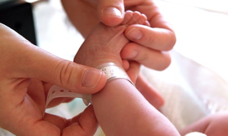 A baby in a maternity ward