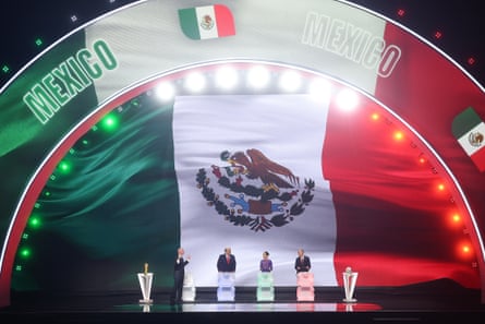 Claudia Sheinbaum, president of Mexico, and Mark Carney, prime minister of Canada, stand on stage with Gianni Infantino, president of FIFA, for the draw during the FIFA World Cup 2026