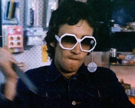 Gary Waddell wearing sunglasses in a still from the film Pure Shit