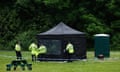 Views Of Maidenhead Park Where Royal Marine On Spy Charge Was Found Dead<br>MAIDENHEAD, ENGLAND - MAY 22: Police stand next to a welfare tent in an area cordoned off in Grenfell Park on May 22, 2024 in Maidenhead, England. Ex-Royal Marine Matthew Trickett, 37, was found dead in Grenfell Park on Sunday afternoon. Police are treating his death as "unexplained". Trickett was on bail accused of assisting the Hong Kong intelligence service at the time of his death. (Photo by Dan Kitwood/Getty Images)