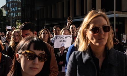People attend a rally in support of former ABC Q&A host Stan Grant in Sydney