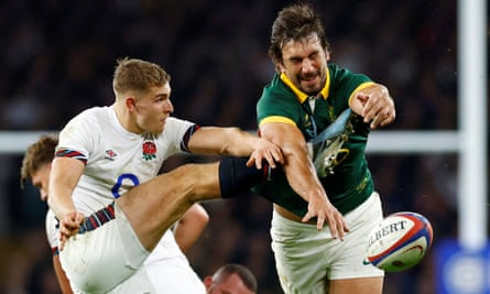 England’s Jack van Poortvliet has a kick blocked by Eben Etzebeth.
