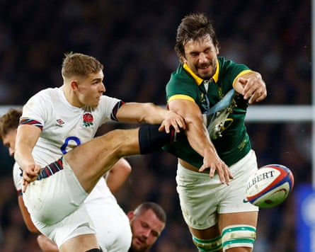 The South Africa rugby union forward Eben Etzebeth charges down a kick from the England scrum-half Jack van Poortvliet.