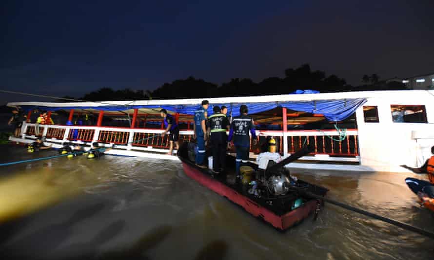 Rescue workers arrive at the stricken boat