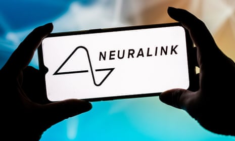 Two hands hold a smartphone screen showing the logo of neurotechnology company Neuralink Corporation in black and white.