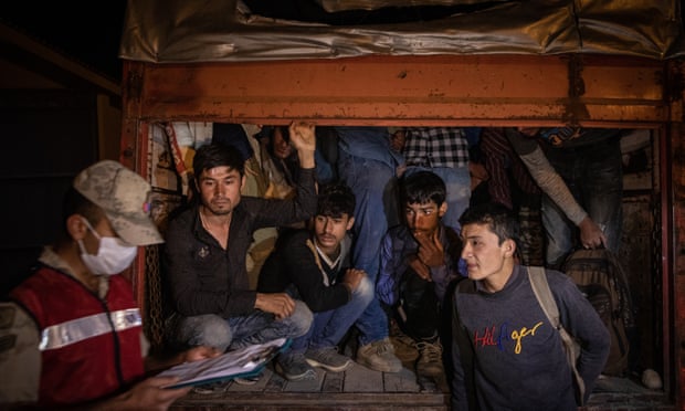 Refugees in back of truck