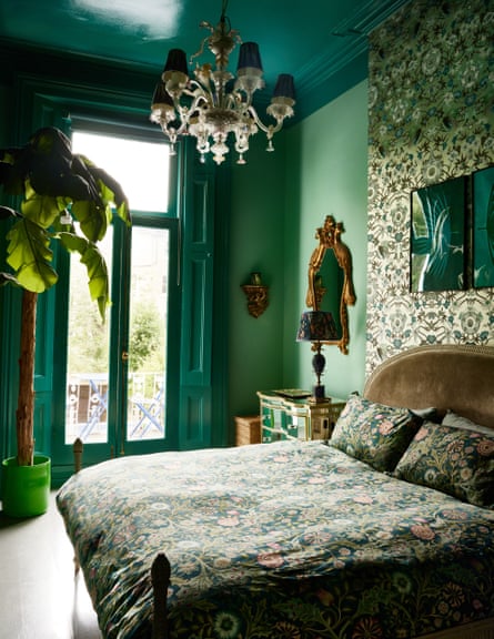 The mint green bedroom, with floral bedspread.