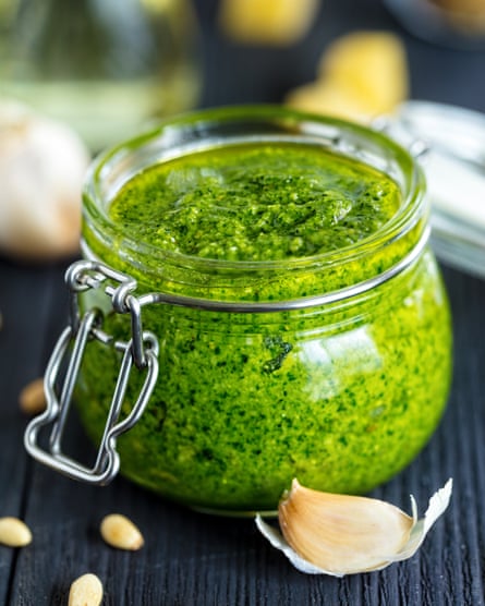 Freshly made basil pesto sauce in glass jar