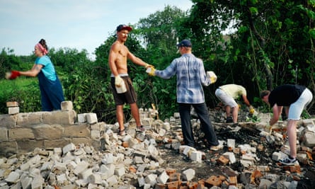 Volunteers from Repair Together cleaning up a house site.