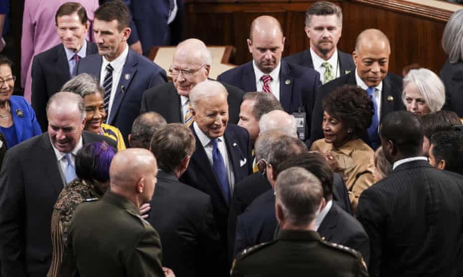 biden surrounded by lawmakers