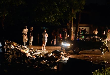 People construct a makeshift roadblock out of rubbish to protest blackouts in Havana.
