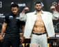 Filip Hrgovic flexes his arms while shirtless under a leather jacket as Moses Itauma looks on during the Natural Born Thriller press conference ahead of the IBF world heavyweight fight at the O2
