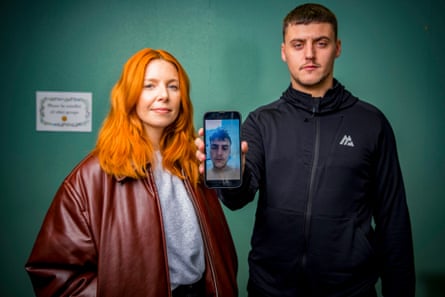 Stacey Dooley stands with Jensen, who holds a phone showing his before photo