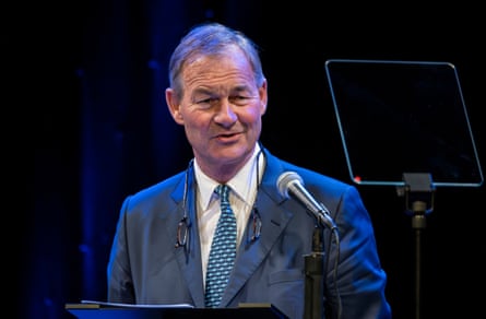 Lowe at a podium