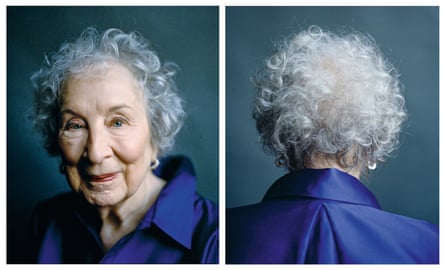a picture of her looking at the camera wearing a deep-purple dress and silver earrings, and a second picture alongside it of her turned round so that we see the back of her head