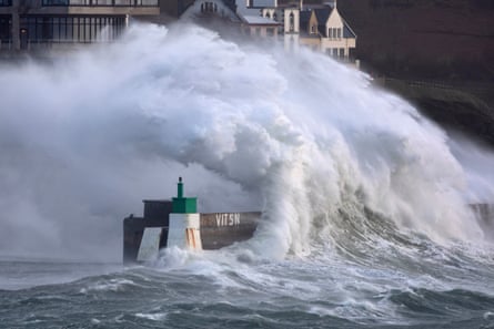 A huge wave crashes on the jetty of the harbour at Le Conquet, western France