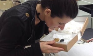 Researcher Caro Verbeek smells a pomander.