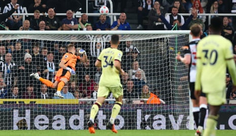 Arsenal’s keeper Aaron Ramsdale is relieved to see the shot from Newcastle United’s Callum Wilson shot whizz just wide of the upright.