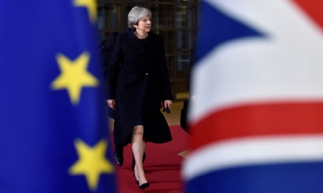 Theresa May photographed through an EU flag and a union flag
