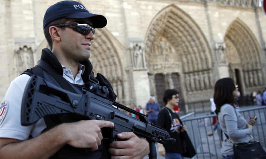 A police officer in front of Notre Dame Cathedral in Paris days after the attempted attack